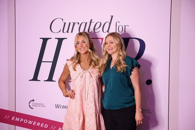 Riley Gaines speaking with an attendee at the 2026 Women's Leadership Summit in San Antonio, Texas