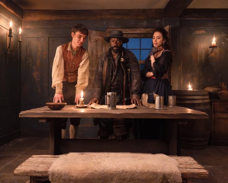 Tom Sweet as Jim Hawkins, David Oyelowo as Long John Silver, and Hayley Atwell as Bess Hawkins in Treasure Island