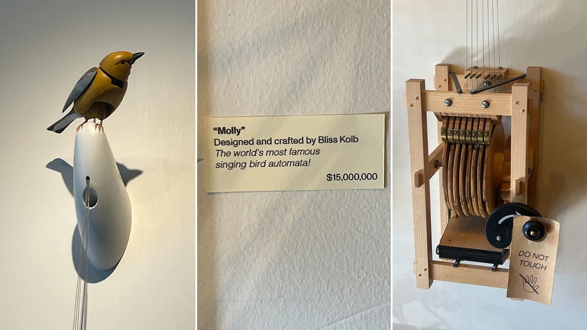 Molly the mechanical singing bird beside the $15 million price sign at Art of Play in Brooklyn