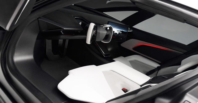Interior of the redesigned Tesla Roadster with yoke steering and central display