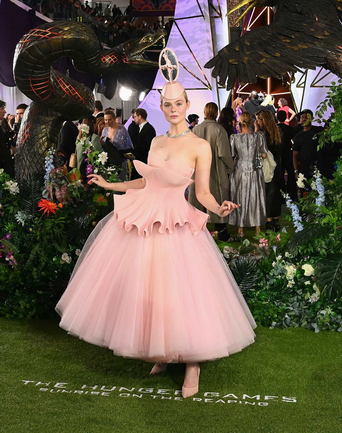 Elle Fanning in Robert Wun pink couture channeling Effie Trinket, London October 2026