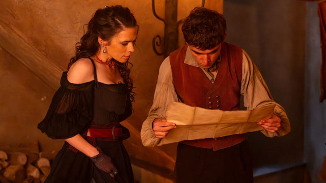 Hayley Atwell as Bess Hawkins and Tom Sweet as Jim Hawkins examining the treasure map in Treasure Island (2026), official Paramount+ promotional image