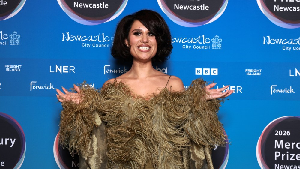 Raye in Taller Marmo satin dress and opera coat at Mercury Prize 2026