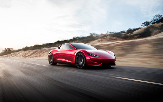 Red Tesla Roadster concept car shown on Tesla's official Roadster webpage