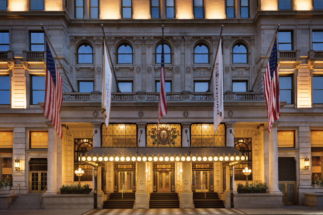 The Plaza Hotel's illuminated Fifth Avenue entrance in Manhattan