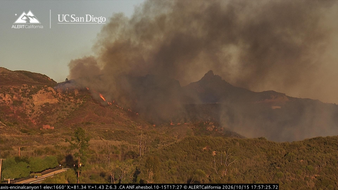 AlertCalifornia camera image showing smoke and flames on the hillside during the October 15, 2026 Bryson Fire near Malibu
